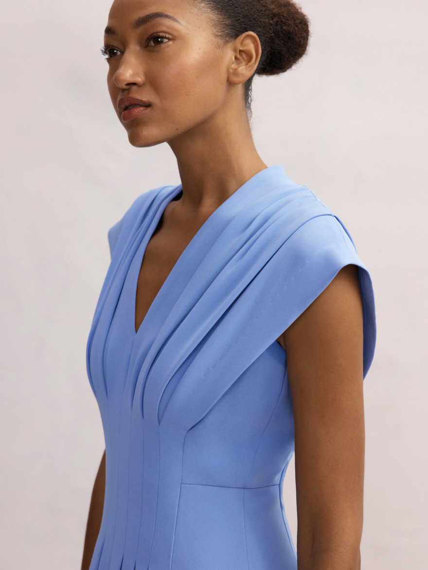 Model wearing cornflower blue Tivoli dress