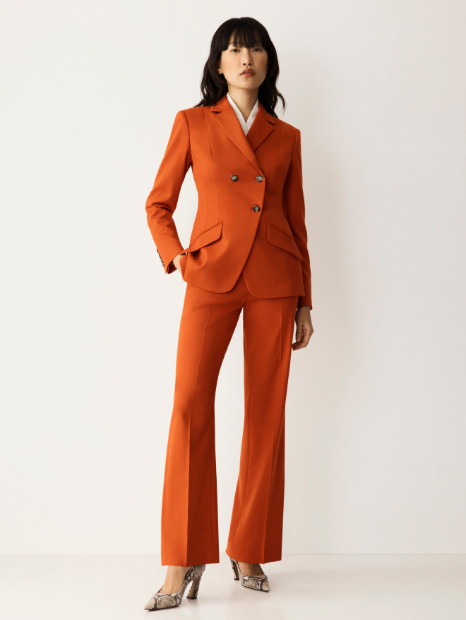 Model wearing burnt orange Tailoring