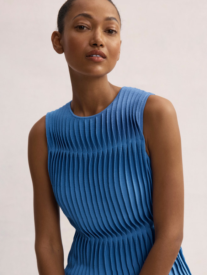 Model wearing cornflower blue Allegra top