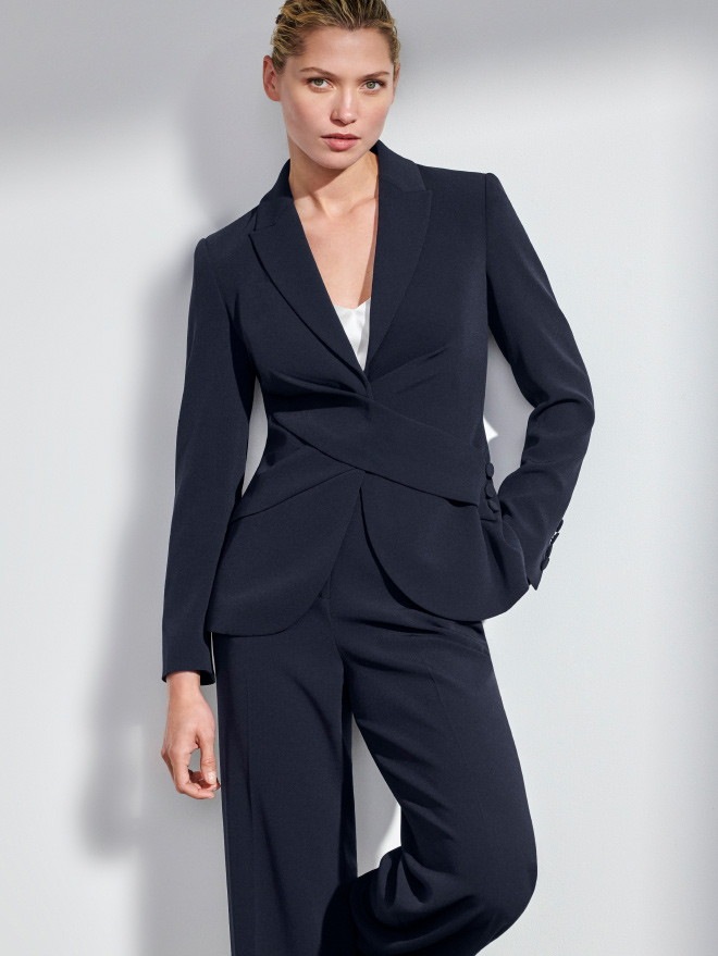 Model wearing navy Clever Crepe suiting